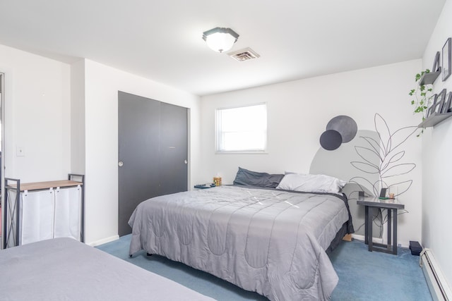 bedroom with visible vents, carpet floors, baseboard heating, and baseboards