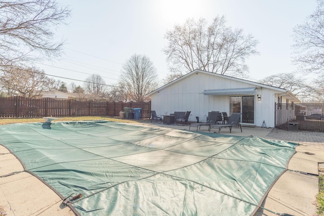 view of pool with a fenced in pool, a patio, and fence