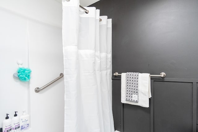 bathroom with a shower with curtain