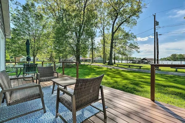 wooden terrace with a lawn and an outdoor living space