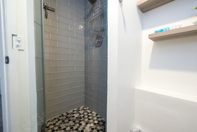 full bath featuring a shower stall