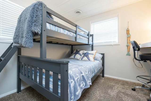 carpeted bedroom with baseboards and visible vents