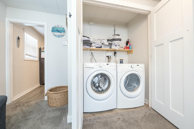 washroom with laundry area, carpet, and washer and dryer