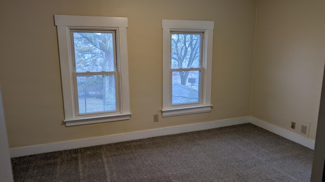 unfurnished room featuring carpet floors