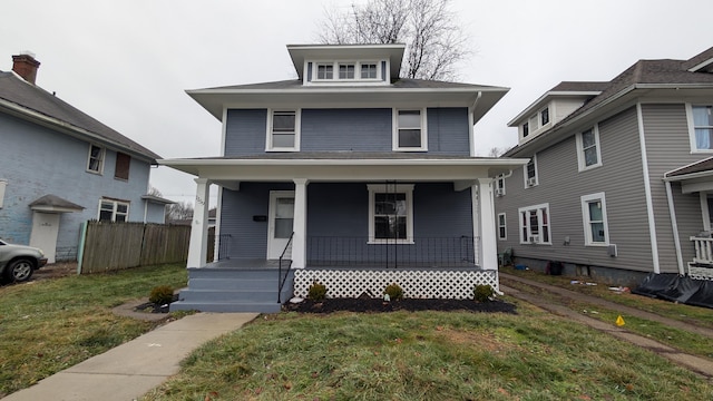 view of front of house featuring a porch and a front lawn