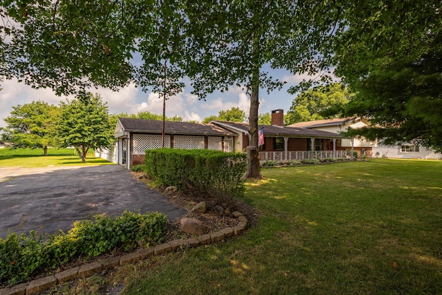 302 N W St, Arcanum, OH 45304 - view of grassy yard with asphalt driveway