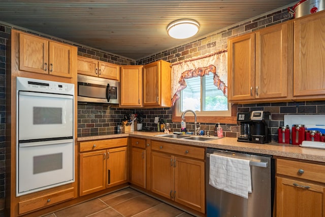 302 N W St, Arcanum, OH 45304 - kitchen featuring stainless steel appliances, light countertops, tasteful backsplash, wooden ceiling, and tile patterned flooring