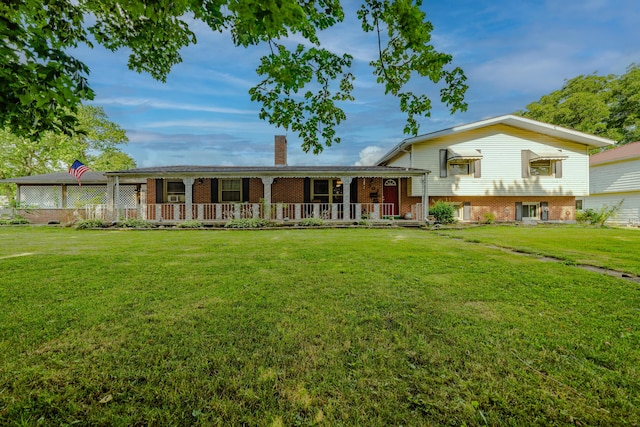 302 N W St, Arcanum, OH 45304 - tri-level home featuring covered porch, brick siding, a front lawn, and a chimney
