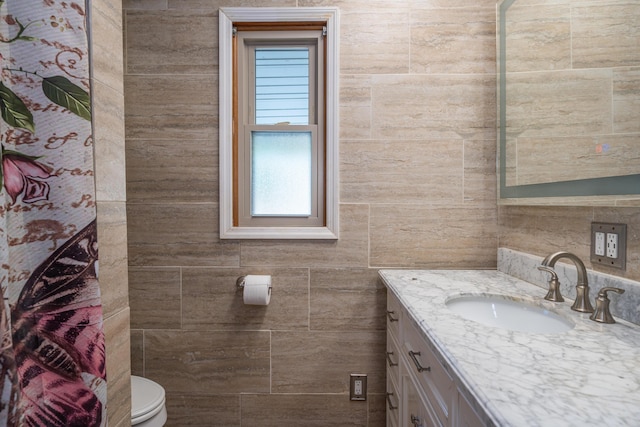 302 N W St, Arcanum, OH 45304 - bathroom with vanity, tile walls, and healthy amount of natural light
