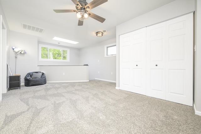 11531 Circle Dr, Lakeview, OH 43331 - unfurnished bedroom with carpet flooring, a closet, and a ceiling fan