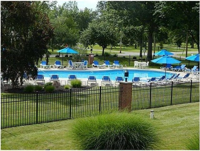 10339 County Road 286 Unit D4, Huntsville, OH 43324 - community pool with a patio area and view of scattered trees