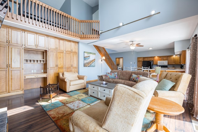 10339 County Road 286 Unit D4, Huntsville, OH 43324 - living area featuring a high ceiling, ceiling fan, light wood finished floors, stairway, and baseboards