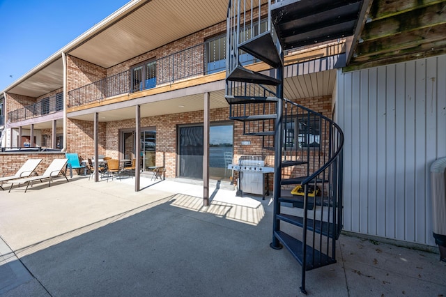 10339 County Road 286 Unit D4, Huntsville, OH 43324 - view of patio featuring stairway and a balcony