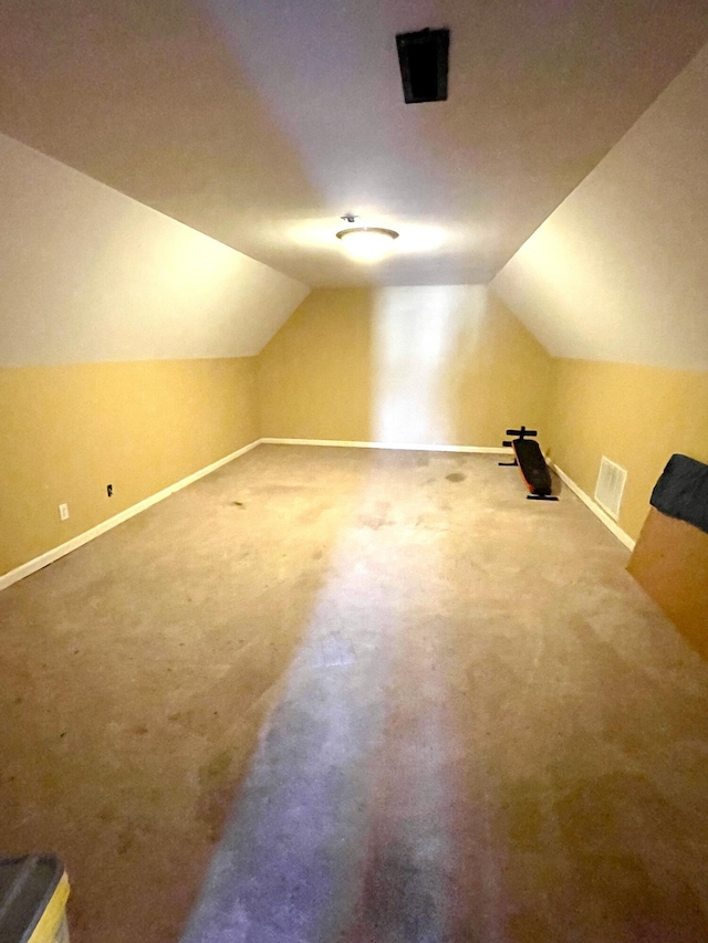 bonus room featuring visible vents, baseboards, and lofted ceiling