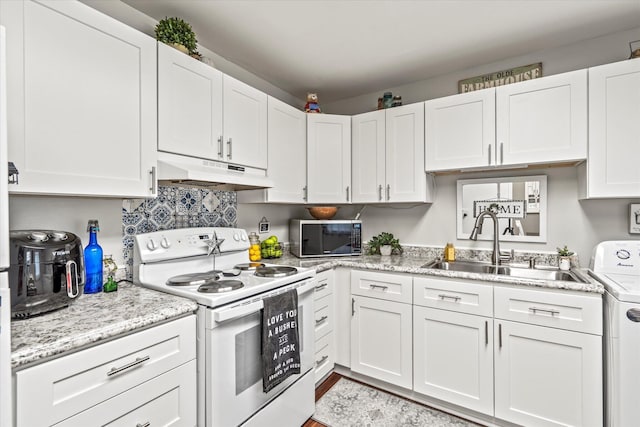 kitchen featuring white electric range, sink, white cabinetry, light stone counters, and washer / clothes dryer