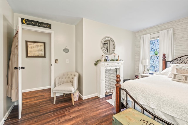 bedroom with dark hardwood / wood-style flooring