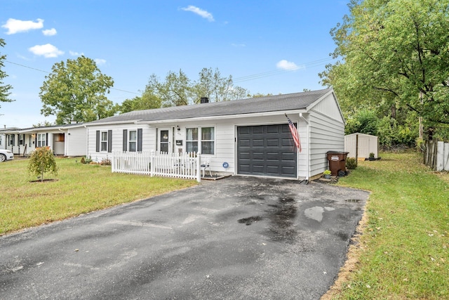 ranch-style home with a garage and a front yard