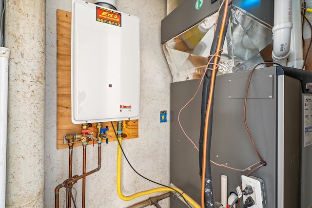 utility room featuring water heater