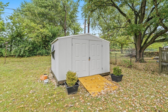 view of outdoor structure with a lawn