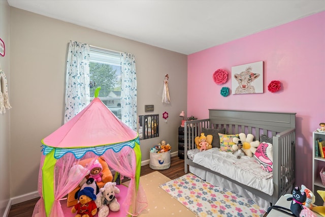 bedroom with hardwood / wood-style floors