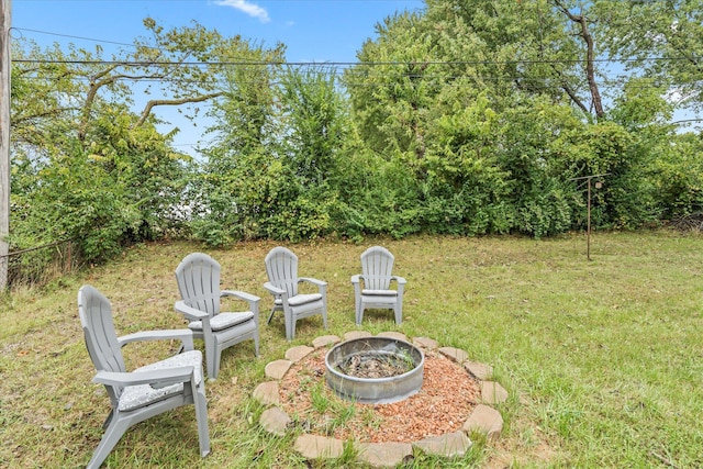 view of yard with a fire pit