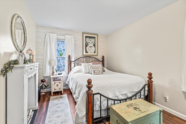 bedroom with dark wood-type flooring