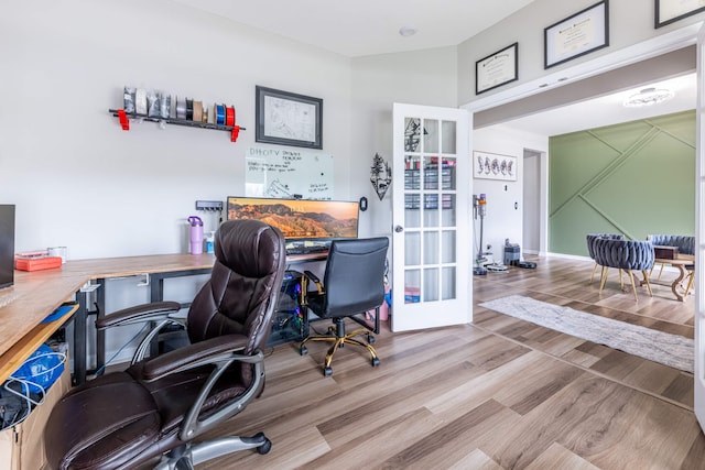 office space featuring wood finished floors and french doors