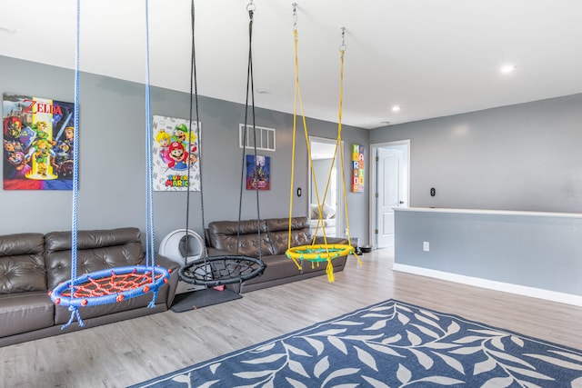 rec room with baseboards, visible vents, wood finished floors, and recessed lighting