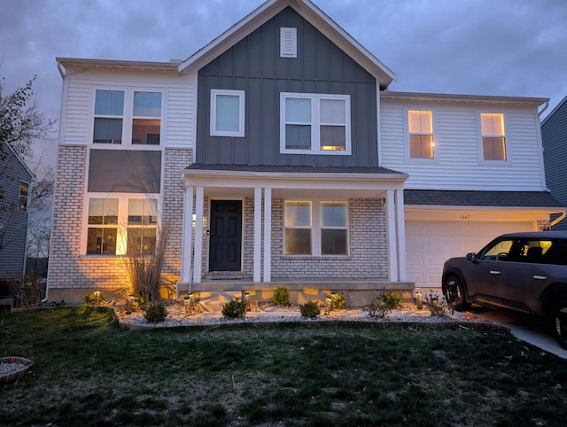 view of front of property featuring a porch, a front lawn, a garage, board and batten siding, and brick siding