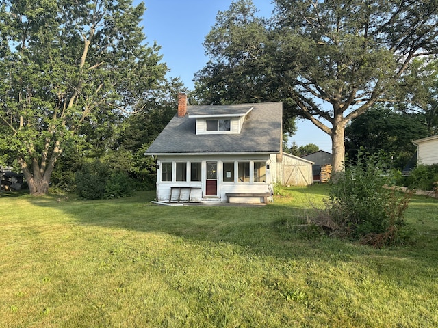 131 Clearview Ct, Saint Marys, OH 45885 - view of front of house featuring a chimney, entry steps, and a front lawn