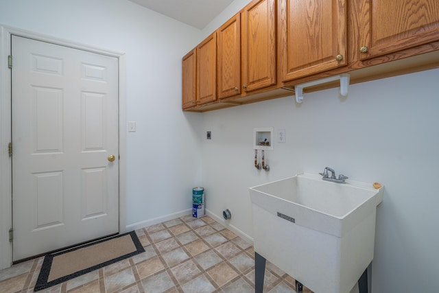 laundry room featuring cabinets, hookup for an electric dryer, hookup for a washing machine, and sink