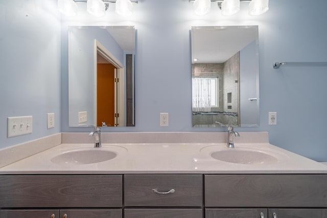 bathroom with vanity and an enclosed shower