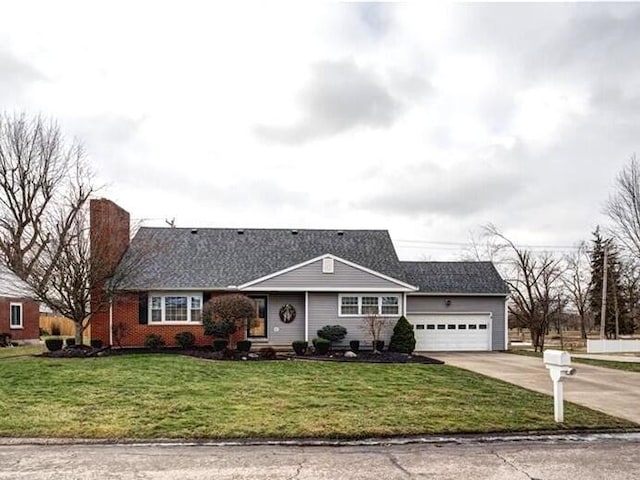 ranch-style house featuring a garage and a front lawn