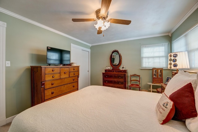 bedroom featuring baseboards, crown molding, and ceiling fan