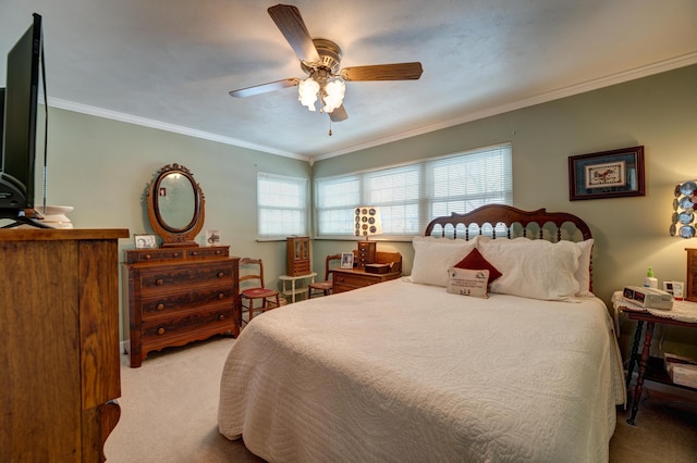 carpeted bedroom featuring multiple windows, ceiling fan, and crown molding