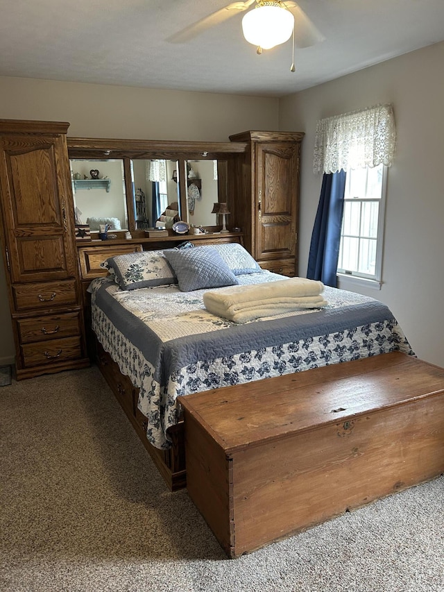 bedroom featuring ceiling fan and carpet flooring