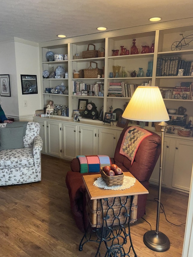 sitting room with hardwood / wood-style flooring