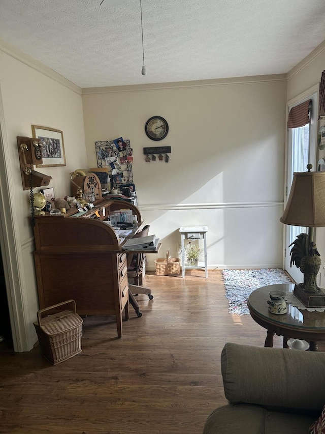 home office featuring crown molding, hardwood / wood-style floors, and a textured ceiling