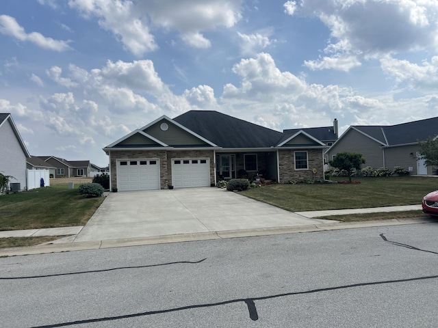 107 Woodbine Dr, Wapakoneta, OH 45895 - ranch-style house with stone siding, concrete driveway, a front lawn, and a garage