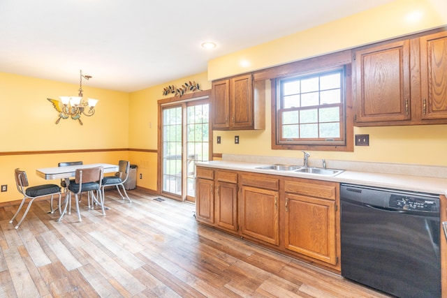 9162 Township Road 169 N, West Liberty, OH 43357 - kitchen with black dishwasher, a sink, light countertops, and brown cabinets