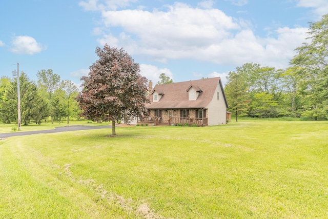 9162 Township Road 169 N, West Liberty, OH 43357 - cape cod house with a front lawn and a deck