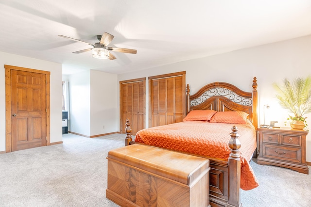 9162 Township Road 169 N, West Liberty, OH 43357 - bedroom with light colored carpet, multiple closets, a ceiling fan, and baseboards
