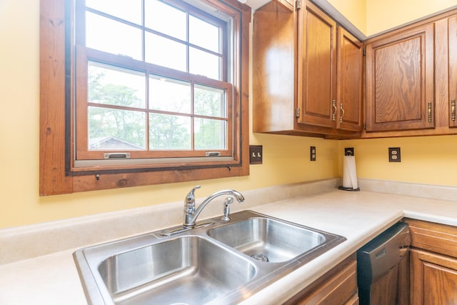 9162 Township Road 169 N, West Liberty, OH 43357 - kitchen with a sink, dishwasher, light countertops, and brown cabinets