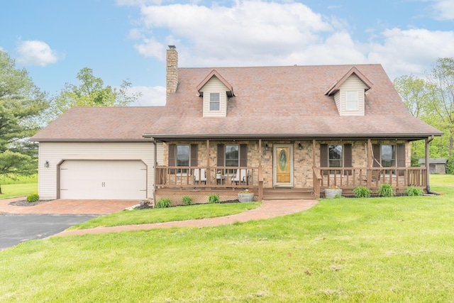 9162 Township Road 169 N, West Liberty, OH 43357 - new england style home featuring a porch, a garage, a chimney, a front yard, and driveway