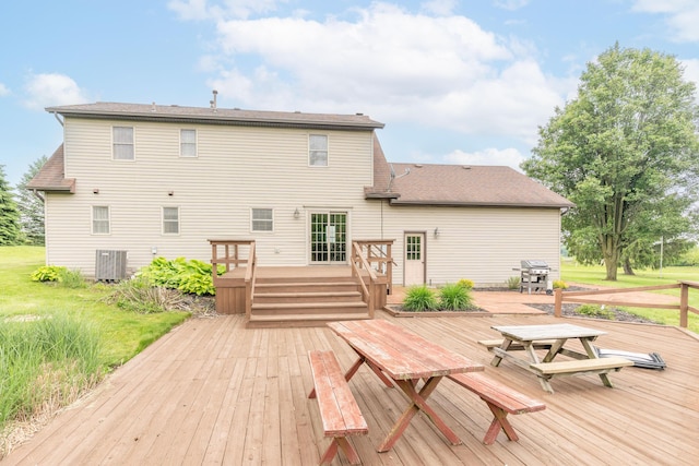 9162 Township Road 169 N, West Liberty, OH 43357 - wooden terrace with central air condition unit, grilling area, a lawn, and outdoor dining area