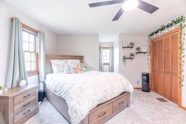 9162 Township Road 169 N, West Liberty, OH 43357 - bedroom with light colored carpet, a closet, baseboards, and a ceiling fan