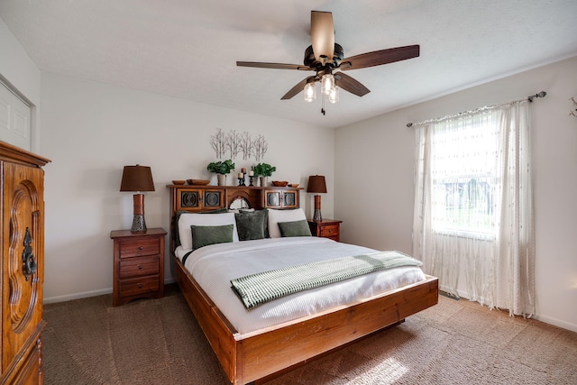 bedroom with baseboards, ceiling fan, and light carpet