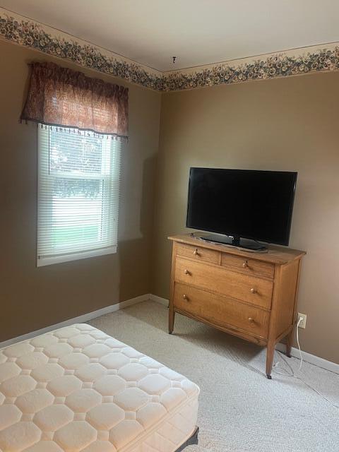 bedroom featuring baseboards
