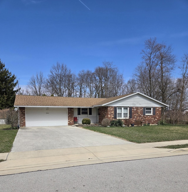 view of front facade featuring a garage, concrete driveway, brick siding, a front lawn, and covered porch