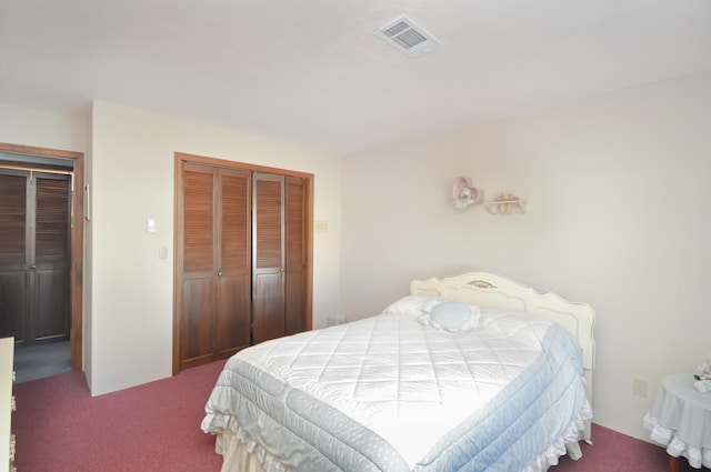 bedroom with carpet and a closet